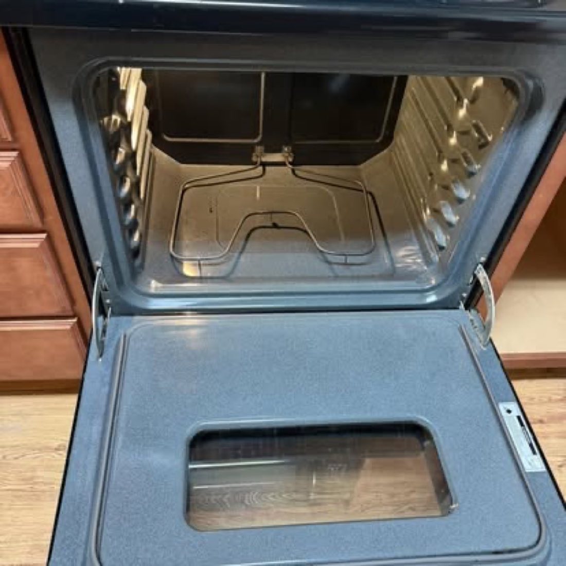 The same oven interior after cleaning, clean metal