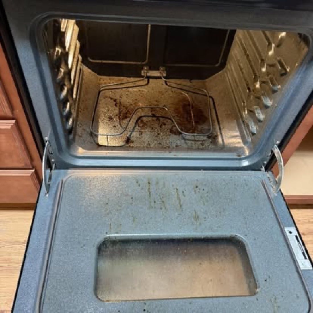 Oven interior before cleaning, heavy baked-on grease