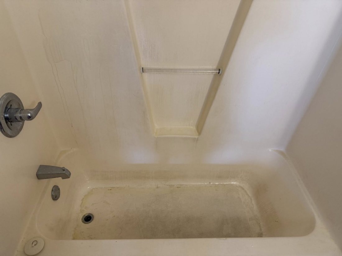 Bathtub before cleaning, soil and residue
